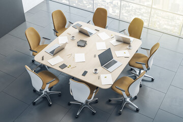 Wall Mural - Top view on square wooden conference table with laptops, papers and notes surrounded by modern yellow chairs on dark ceramic floor and city view from huge window. 3D rendering