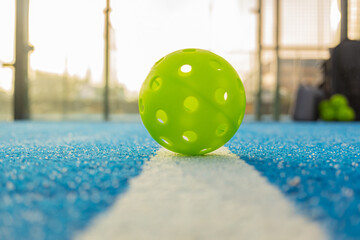 a ball on the line in a pickleball court, racket sport concept background, background of racket sport concept