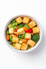 Colorful vegetable and tofu stir-fry in a bowl