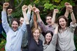 © Asier - Group of happy young people raising their hands in the air and laughing