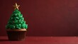 © Natasa - Christmas tree cupcake on red background with copy space.