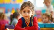 © LukaszDesign - Image of a young child seated at a desk in an early childhood education setting