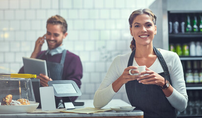 Sticker - Coffee, happy and portrait of woman barista in cafe at checkout register in morning for opening. Smile, confident and female waitress or server drinking caffeine, cappuccino or latte at restaurant.