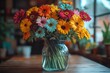 © Vladimir - A colorful bouquet of flowers in a glass vase filled with clean water, placed on a wooden table