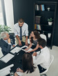 © peopleimages.com - Above, architecture and business people in meeting, tablet and conversation with planning in office. Employees, blueprints and coworkers with documents, tech and digital app with research or teamwork