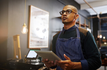 Fototapete - Man, tablet and thinking in cafe, small business and online for professional brainstorming. Male person, restaurant manager and internet for coffee shop agenda, contemplating growth and ponder store