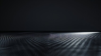 Carbon Fiber Texture Illuminated from the Right Against Black Surface.