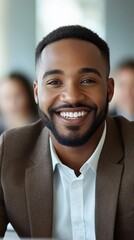 Wall Mural - A man with a beard and a smile is wearing a brown suit and a white shirt. He is smiling and looking at the camera