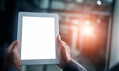 Aufkleber - man holding tablet in hand with blank screen over a isolated copy space background. closeup of busin