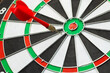 © patpitchaya - An arrow that missed the center of the target by a short distance, something close to success, almost done, motivation concept, or inaccurate communication