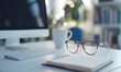 © 子熙 陈 - Glasses, computer, and notebook on the table