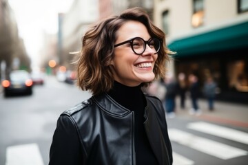 Portrait of a beautiful woman in black leather jacket with eyeglasses