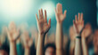 © PrusarooYakk - A crowd of raised hands, symbolizing participation, excitement, or agreement in a vibrant setting.