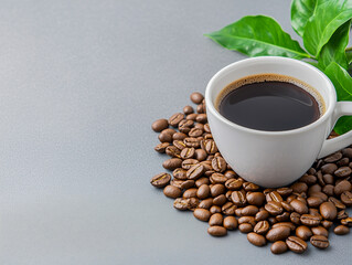 Cup of black coffee with beans and leaves 