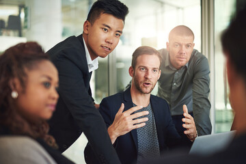 Poster - Team, discussion and man in office with laptop, ideas and feedback on project management ideas. Leadership, diversity and group of business people in meeting with mentor, advice or planning strategy