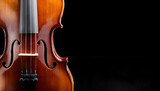 A detailed close-up of a classical violin, showcasing its elegant craftsmanship against a dramatic black background, highlighting the beauty of string instruments