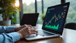 © NeuroArtStream - Stock market analysis on laptop in modern office