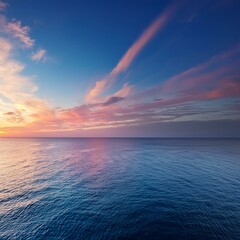 Wall Mural - sunset over calm ocean with pink and blue sky
