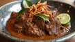 © aubriella - A mouthwatering plate of Indonesian rendang, slow-cooked beef in coconut milk and aromatic spices, Rendang plate centered