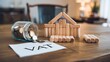 © Natalia - Creative representation of tax savings with building blocks, coins, and a VAT document on a rustic wooden table.