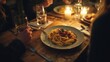 © Alex - A cozy dinner setting with delicious pasta served on a wooden table under warm candlelight. Perfect for sharing moments with friends.
