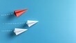 © Ranazain - Red paper plane leading two white paper planes on blue background, symbolizing leadership innovation