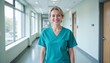 © Volha - Smiling nurse in the hospital corridor, Friendly medical staff