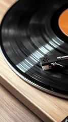 A close-up of a vinyl record playing on a turntable, showcasing the groove details and stylus resting on the record surface.