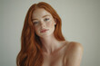 © Thomas Parker - Beautiful young red haired woman with slim body, posing in underwear isolated on white studio background. Natural female beauty. Self-care and wellness. Body and skin care.