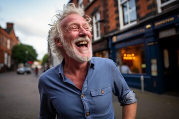 Portrait of a senior man laughing in the street of London.