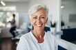 © Vorda Berge - Portrait of a senior American woman smiling at dentist office