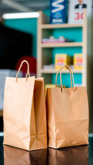 Sticker - two brown paper bags on a shiny surface