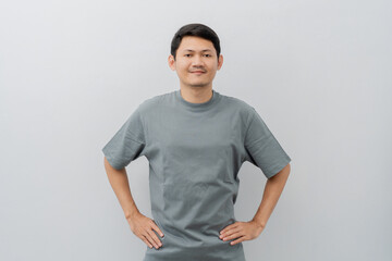 Happy expression of adult Asian man with casual t-shirt isolated on white background