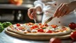 © Faxri - Professional female chef in a restaurant making pizza by adding cheese, special sauce, and ingredients. Cooking using a family's traditional recipe. A true Sunny Italian Pizzeria.