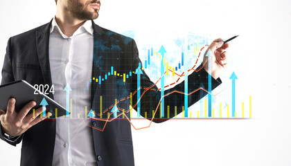 Wall Mural - Businessman with tablet analyzing financial charts and data with upward trend on a white background.