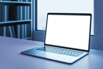 Poster - Perspective view on blank white illuminated modern laptop screen with copyspace for your text or logo on empty table on blurred bookcase and window background. 3D rendering, mockup