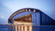 © Andrew - A massive aviation hangar with wide, open doors, large enough to house a commercial airplane.