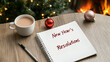 © AIPhoto - New Years resolutions are written in notebook beside cup of coffee, festive ornaments, and cozy fireplace, creating warm and inviting atmosphere