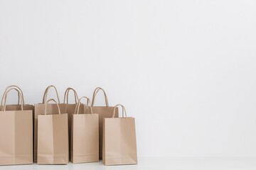 several shopping bags placed in white room with sunlight, black friday and seasonal sales concept, discounts and online offers, news, shopping and consumerism