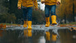 © ArtBox - Children in Yellow Boots Splashing in Puddles