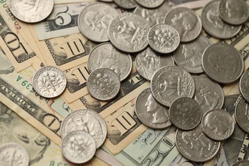 Wall Mural - Many different dollar bills and silver cent coins under natural light