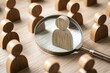 © jureephorn - A recruitment process depicted with a magnifying glass zooming in on diverse talent, representing the focus on identifying and selecting candidates from various backgrounds