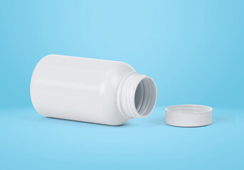 Blank plastic pill bottle on a light blue background