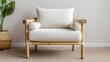 © Apaporn - Stylish modern armchair with a comfortable white cushion, bamboo frame, and minimalistic design, perfect for contemporary living spaces.
