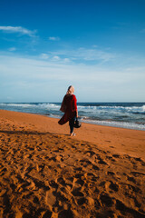 person walking in a beach