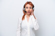 © luismolinero - Telemarketer Russian girl working with a headset isolated on white background with surprise and shocked facial expression