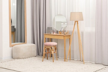 Wall Mural - Mirrors, dressing table, lamp and stool near window indoors. Interior design