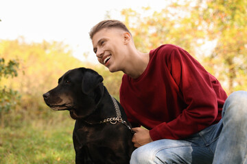 Sticker - Smiling man with cute dog outdoors on autumn day