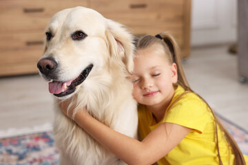 Canvas Print - Girl with her cute Golden Retriever dog at home