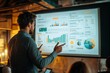 © DK_2020 - A business professional presenting a financial business plan, earnings, and sales strategy, with important data points highlighted on a large screen